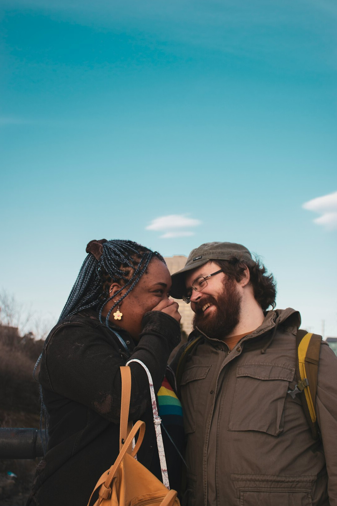 Two people smiling in a warm conversation