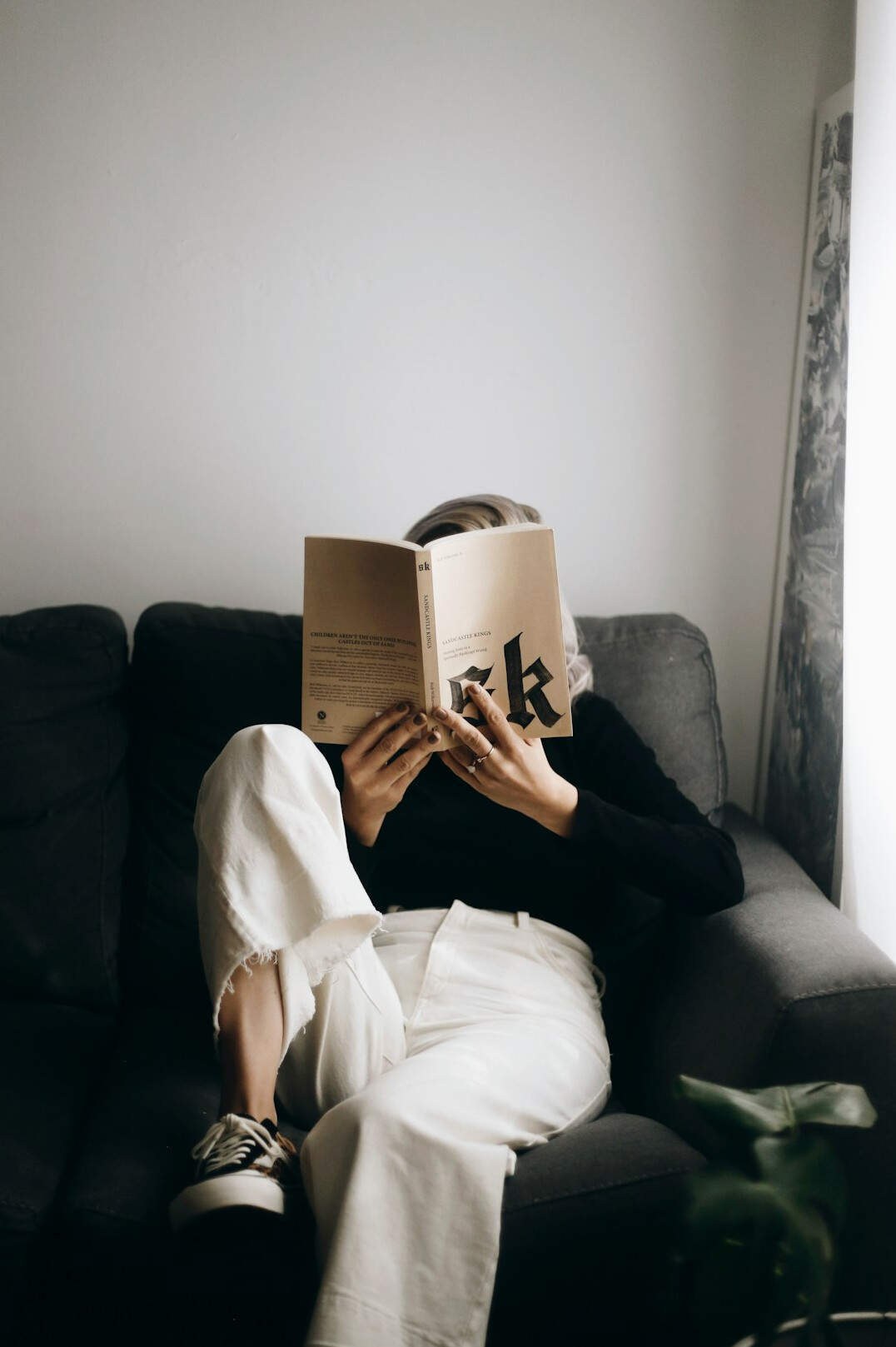 person reading self help book
